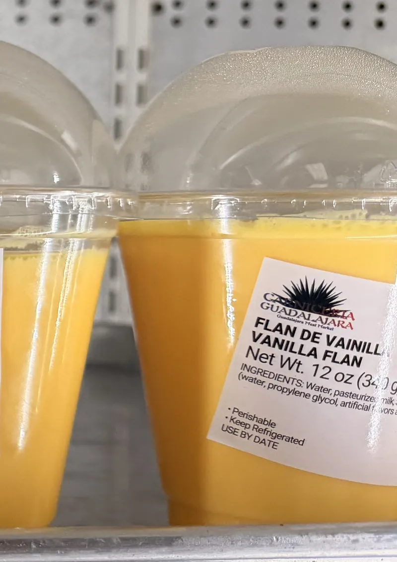 Cups of vanilla flan with the Carniceria Guadalajara label